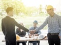 Businessmen architects shaking hands. architect met in the office to discuss business projects. Successful young people in the