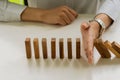 Businessmen build wooden block towers as a symbol of development and planning in business. Strategies for success and planning. Ri