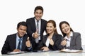 Businessmen and businesswomen giving thumbs up. Conceptual image Royalty Free Stock Photo