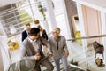 Businessmen and businesswomen walking and taking stairs in an of Royalty Free Stock Photo