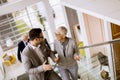 Businessmen and businesswomen walking and taking stairs in an of Royalty Free Stock Photo