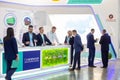 Businessmen communicate at the International exhibition of transport and logistics services