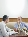 Businessmen Dining In Restaurant