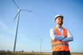 Businessmen engineering standing handsome smile front of turbine looking away