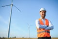 Businessmen engineering standing handsome smile front of turbine looking away