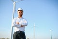 Businessmen engineering standing handsome smile front of turbine looking away