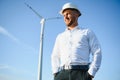 Businessmen engineering standing handsome smile front of turbine looking away