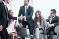 Businessmen greet each other with a handshake