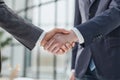 Building a strong business network. two businessmen shaking hands in a modern office. Royalty Free Stock Photo