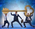 Businessmen holding giant key in business concept Royalty Free Stock Photo