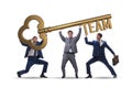 The businessmen holding giant key in team concept Royalty Free Stock Photo