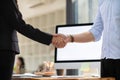 Businessmen and investors shake hands after attending meeting with advisory team after receiving advice from advisory team about