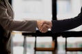 Businessmen and investors shake hands after attending meeting with advisory team after receiving advice from advisory team about