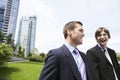 Businessmen Laughing By Office Buildings Royalty Free Stock Photo
