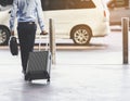 Businessmen leave with baggage at the airport.Focus on luggage.