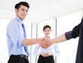 businessmen making agreement and colleague standing near b