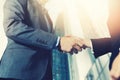 Businessmen meeting and handshake in front of business center