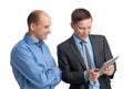 Businessmen meeting and looking at tablet computer