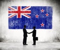 Businessmen with New Zealander Flag Royalty Free Stock Photo