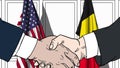 Businessmen or politicians shake hands against flags of USA and Belgium. Official meeting or cooperation related cartoon