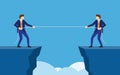 Businessmen pull the rope at edge of cliff Royalty Free Stock Photo