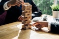 Businessmen pulling block wooden fail danger Royalty Free Stock Photo