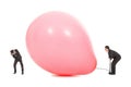 Businessmen scared balloon is inflated to burst Royalty Free Stock Photo