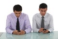 Businessmen sending text messages