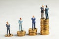 Businessmen shake hands as a symbol of a successful profitable transaction. Businessmen on a stack of gold coins with