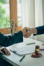 Businessmen shake hands after consulting the law from lawyers, judges, and legal counsel. Consulting services on various contracts