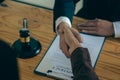 Businessmen shake hands after consulting the law from lawyers, judges, and legal counsel. Consulting services on various contracts