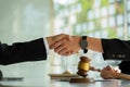 Businessmen shake hands after consulting the law from lawyers, judges, and legal counsel. Consulting services on various contracts