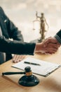 Businessmen shake hands after consulting the law from lawyers, judges, and legal counsel. Consulting services on various contracts