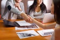 Businessmen shake hands at meeting