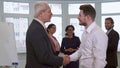 Businessmen shakes hands at the office Royalty Free Stock Photo