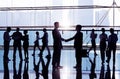 Businessmen Shaking Hand In Office Building Royalty Free Stock Photo