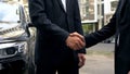 Businessmen shaking hands in agreement, meeting outdoors, informal lobbying Royalty Free Stock Photo