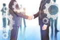 Businessmen shaking hands, cogwheels Royalty Free Stock Photo