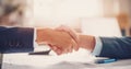 Businessmen shaking hands each other in the office. Royalty Free Stock Photo
