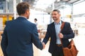 Businessmen shaking hands with each other in office Royalty Free Stock Photo