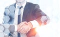 Businessmen shaking hands, hexagons Royalty Free Stock Photo