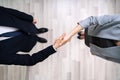 Businessmen Shaking Hands In Office Royalty Free Stock Photo