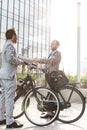 Businessmen shaking hands outside office building Royalty Free Stock Photo