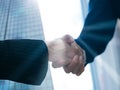 Businessmen shaking hands with partners, introducing their own, doing business, merging and acquiring, forming joint ventures, Royalty Free Stock Photo