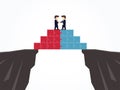 Businessmen shaking hands on a puzzle pyramid on an abyss. Royalty Free Stock Photo