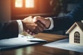 Businessmen shaking hands in a real estate agency. The conclusion of a business transaction with real estate. Confirmation of the Royalty Free Stock Photo