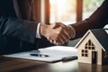 Businessmen shaking hands in a real estate agency. The conclusion of a business transaction with real estate. Confirmation of the Royalty Free Stock Photo