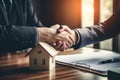 Businessmen shaking hands in a real estate agency. The conclusion of a business transaction with real estate. Confirmation of the Royalty Free Stock Photo