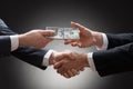 Businessmen shaking hands and receiving money Royalty Free Stock Photo