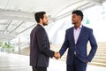 businessmen shaking hands to greet each other outside office Royalty Free Stock Photo